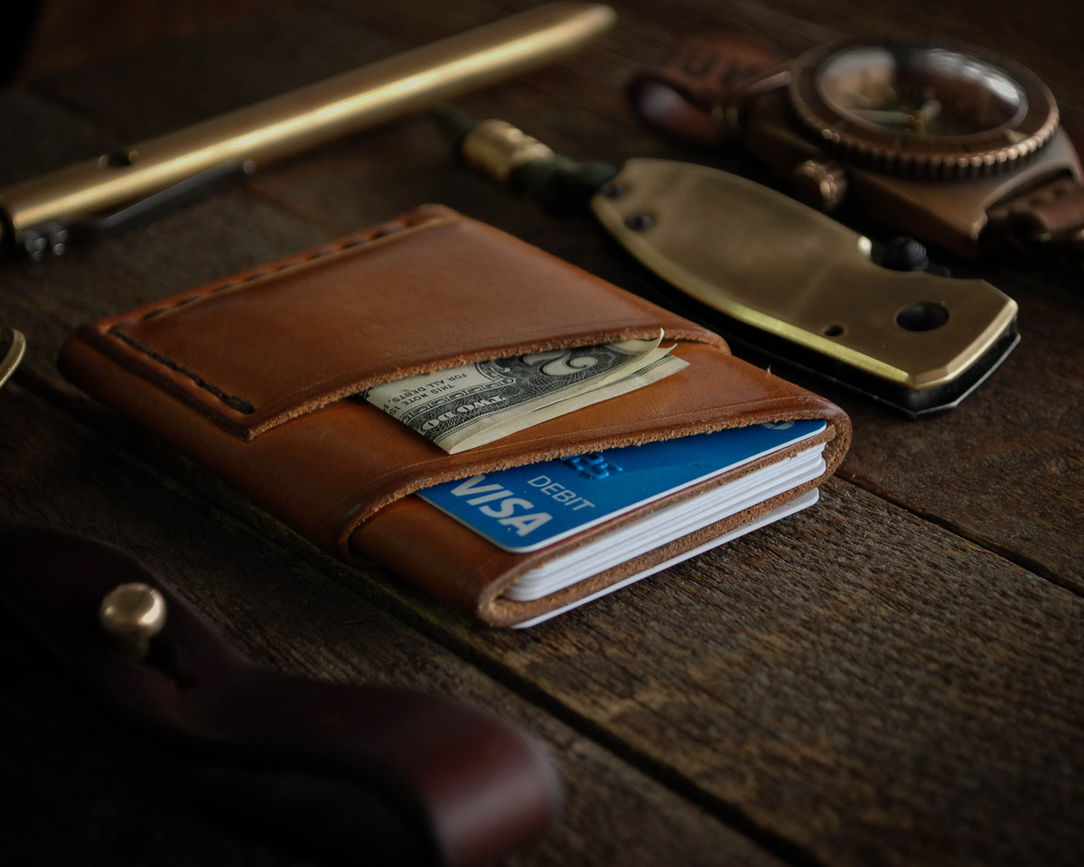 Discover the story behind the Port Wallet, a handcrafted leather wallet known for its quality, utility, and timeless aesthetic. Learn why it continues to be a favorite among everyday carry enthusiasts.